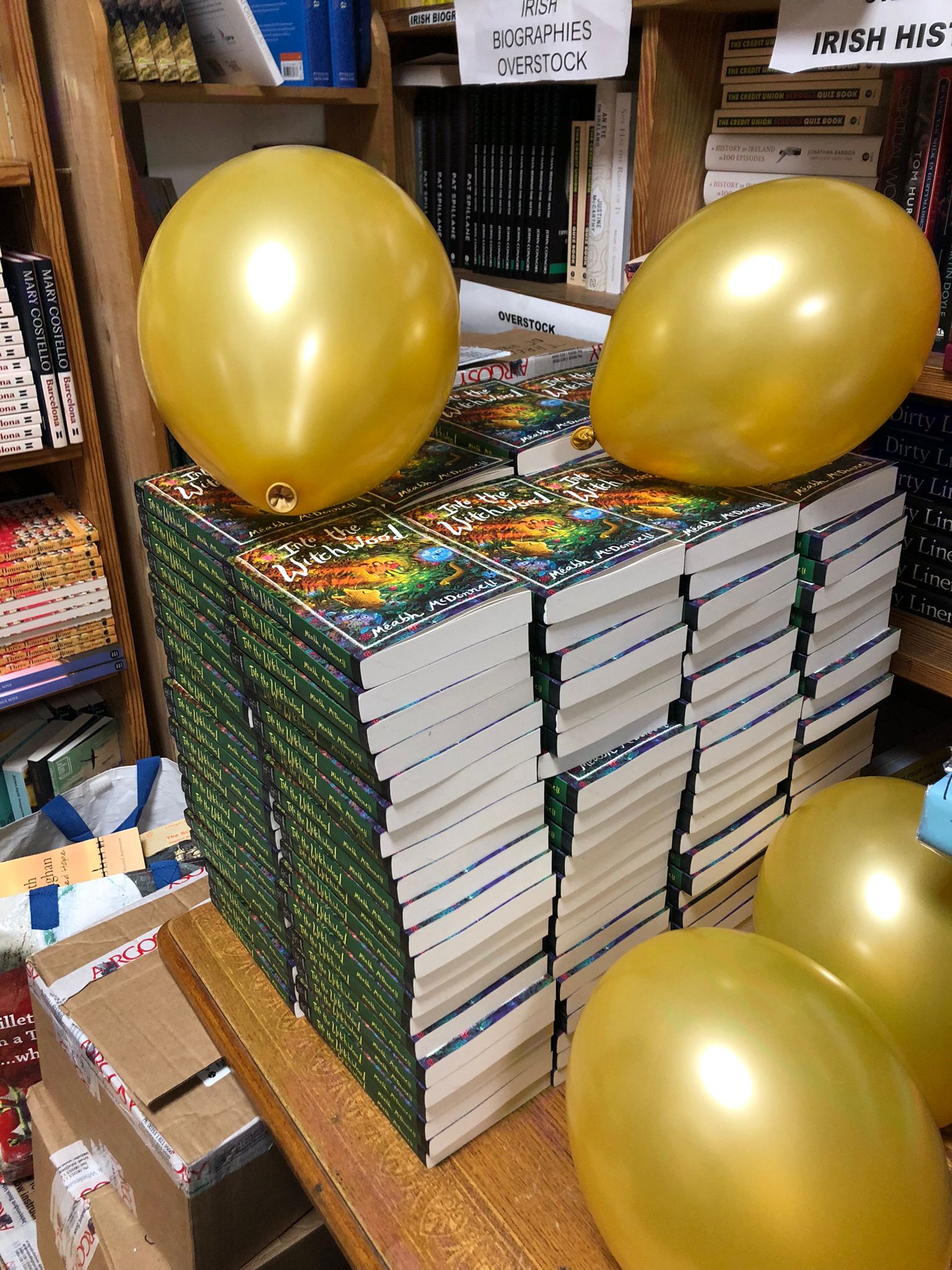 Pile of books with baloons